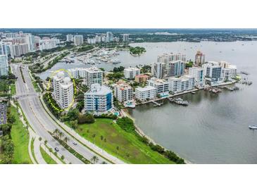 Aerial view showing condo location near water at 128 Golden Gate Pt # 501B, Sarasota, FL 34236