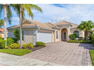 One-story home with tile roof and paver driveway at 13180 Ipolita St, Venice, FL 34293