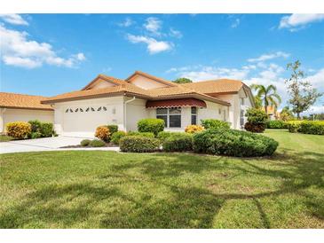 Attractive single-story home with well-manicured lawn and attached garage at 4995 Pepperwood Pl, Venice, FL 34293