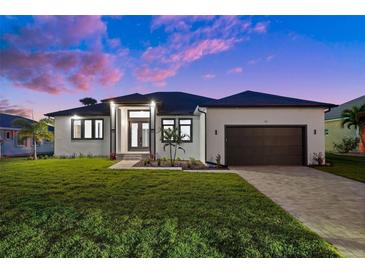 Single story home with modern design and two car garage at 45 Bunker Ln, Rotonda West, FL 33947