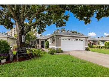 Charming single story home with a lush lawn and mature tree at 2407 Waterford Ct, Palmetto, FL 34221