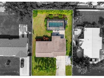 Bird's-eye view of the property, highlighting the house and pool at 521 Live Oak St, Venice, FL 34285