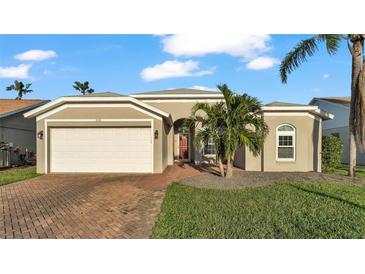 One-story home with a two-car garage and landscaped yard at 5125 40Th W St, Bradenton, FL 34210