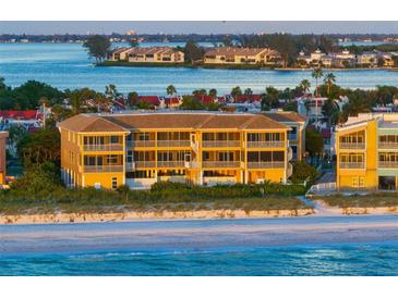Aerial view of beachfront condo building with stunning ocean views at sunset at 1900 Gulf N Dr # 1, Bradenton Beach, FL 34217