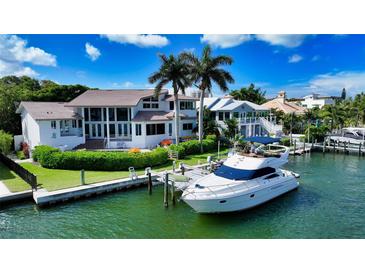 Luxury waterfront home with private boat dock, offering stunning water views at 495 Mckinley Dr, Sarasota, FL 34236