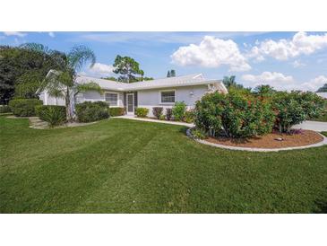 Single-story home with landscaped yard and two-car garage at 3653 Bonaventure Ct, Sarasota, FL 34243