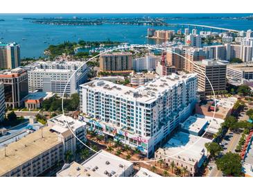Aerial view of a modern building with city and water views at 111 S Pineapple Ave # 1009, Sarasota, FL 34236