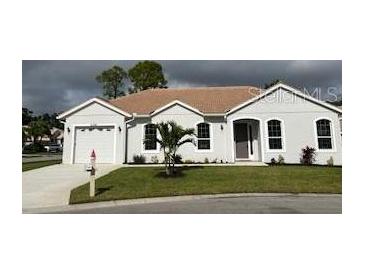 Newly constructed single-story home with attached garage and landscaping at 2128 Waweep Ct, Sarasota, FL 34235