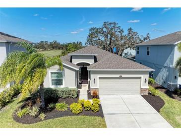 Single-story house with a two-car garage and landscaped front yard at 4519 Bent Tree Blvd, Sarasota, FL 34241