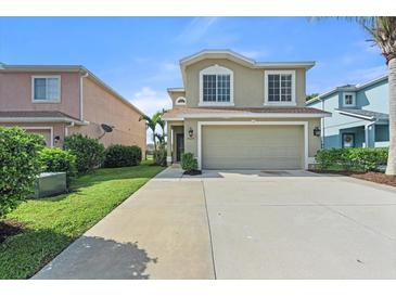 Two-story house with attached garage and landscaped yard at 7022 Chatum Light Run, Bradenton, FL 34212