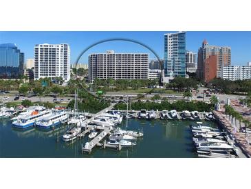 Aerial view of waterfront highrise building near marina at 1255 N Gulfstream Ave # 1003, Sarasota, FL 34236