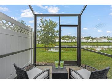 Screened porch overlooking a pond and community at 4119 Via Sienna Cir, Sarasota, FL 34243