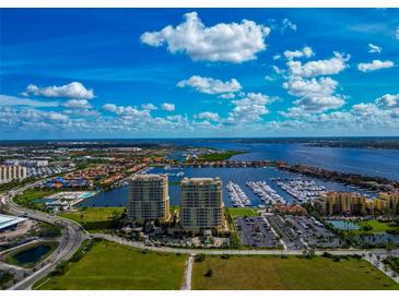 Aerial view of waterfront condos with marina and golf course at 130 Riviera Dunes Way # 204, Palmetto, FL 34221