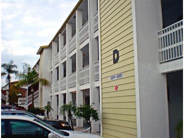 View of the building's exterior, showing its architectural style at 5925 Todd St # D-21, Bradenton, FL 34207