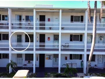 Exterior view of a condo building showing a single unit entrance at 1522 Pleasant Rd # G23, Bradenton, FL 34207