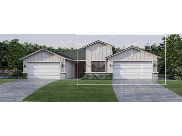Two-story house with gray siding, two-car garage, and a stone facade at 18839 Dayspring Pl, Venice, FL 34293