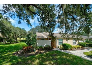 Well-maintained home with lush landscaping and walkway at 3447 Tallywood Ln # 7143, Sarasota, FL 34237