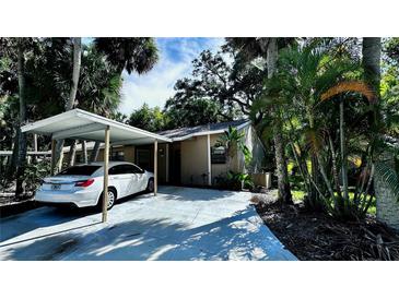 Single-Gathering home with carport and lush tropical landscaping at 5071 Village Gardens Dr # 5, Sarasota, FL 34234