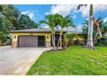 Single-Gathering home with two-car garage and palm trees at 251 Plantation Rd, Venice, FL 34293