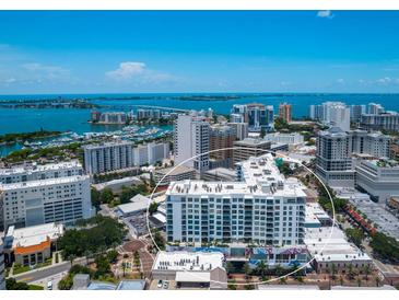 Aerial view of a modern highrise building near the water at 111 S Pineapple Ave # 605, Sarasota, FL 34236