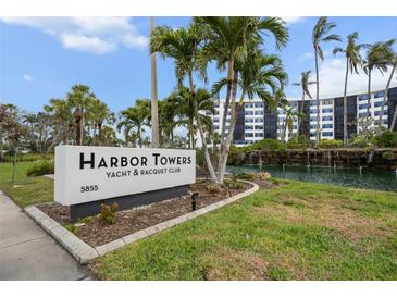 Harbor Towers Yacht & Racquet Club offers waterfront living with lush tropical landscaping and resort-style amenities at 5855 Midnight Pass Rd # 319, Sarasota, FL 34242