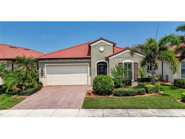 Single-Gathering home with attractive landscaping and driveway at 24252 Gallberry Dr, Venice, FL 34293