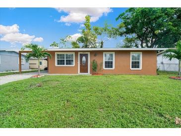 Single story home with a neatly landscaped yard at 2215 19Th E St, Bradenton, FL 34208