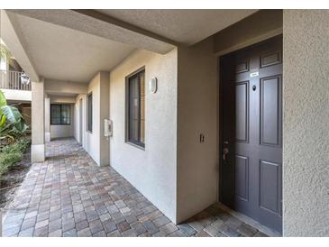 Hallway leading to condo unit with tile floors at 18028 Gawthrop Dr # 104, Bradenton, FL 34211