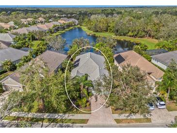 Aerial view of single-Gathering home with lake access in a quiet community at 12121 Thornhill Ct, Lakewood Ranch, FL 34202
