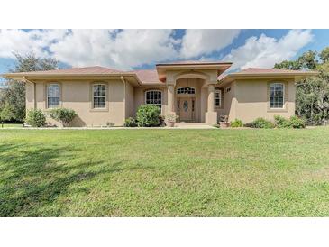 One-story house with a copper roof and landscaped lawn at 6930 69Th E St, Palmetto, FL 34221