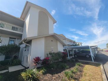 Condo building with covered parking and landscaping at 7201 29Th Avenue W Dr # 308, Bradenton, FL 34209