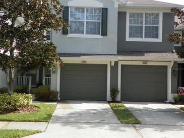 Two-car garage and well-maintained landscaping at 2086 Kings Palace Dr # 2086, Riverview, FL 33578