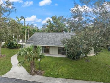 Single story home with a well-manicured lawn at 2212 Bahia Vista St # I1, Sarasota, FL 34239