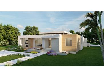 Modern single-story home with clean lines and attractive landscaping at 4014 Bay Shore Rd, Sarasota, FL 34234