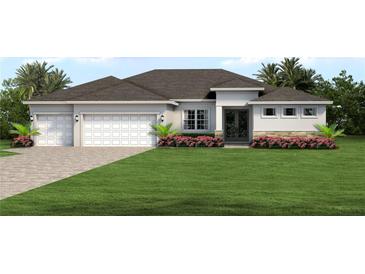 Two-car garage home with attractive landscaping at 27059 Curitiba Dr, Punta Gorda, FL 33983