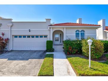 Villa with attached garage and walkway at 4818 61St Avenue W Ter, Bradenton, FL 34210