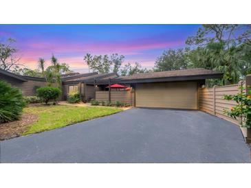 Charming villa with a spacious driveway and landscaped yard at 4520 Chandlers Forde # 51, Sarasota, FL 34235