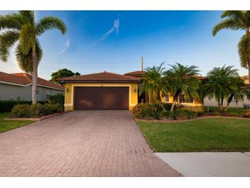 Beautiful single-Gathering home with a brick driveway and landscaping at 6935 74Th Street E Cir, Bradenton, FL 34203