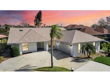 Single-story home with a large yard and attached garage at 2303 89Th Nw St, Bradenton, FL 34209
