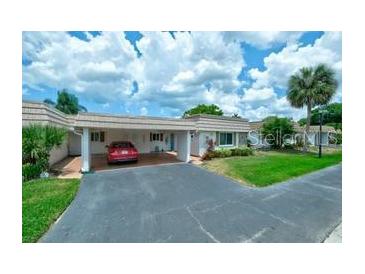 Cute and cozy condo with carport parking and well-maintained landscaping at 2609 Riverbluff Pkwy # 146, Sarasota, FL 34231