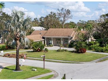 Single-Gathering home on a tree-lined street at 7317 Crape Myrtle Way, Sarasota, FL 34241