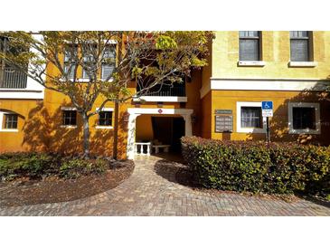 Building exterior with landscaped walkway and entryway at 99 Vivante Blvd # 99315, Punta Gorda, FL 33950