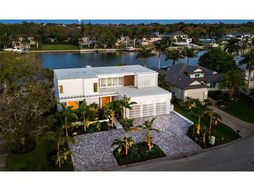 Luxury waterfront home with expansive views at sunset at 3631 San Remo Ter, Sarasota, FL 34239