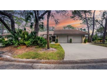 Stunning two-car garage home with landscaped front yard at 3124 Sandleheath # 80, Sarasota, FL 34235