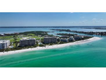 Aerial view of a beach-side condo building at 415 L Ambiance Dr # C703, Longboat Key, FL 34228