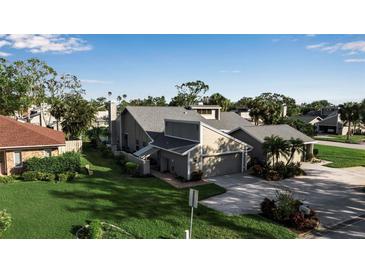 Two-story home with attached garage and landscaped yard at 3410 Avenida Madera # B, Bradenton, FL 34210