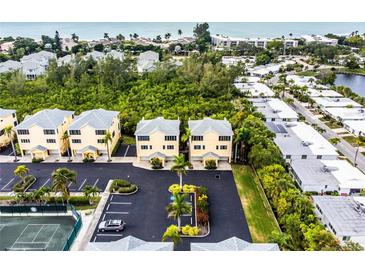 Aerial view of a waterfront condo community at 619 Cedars Ct, Longboat Key, FL 34228