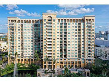 Multi-story building with balconies and water view at 750 N Tamiami Trl # 302, Sarasota, FL 34236