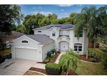 Two-story house with attached garage and landscaping at 228 36Th Ne St, Bradenton, FL 34208