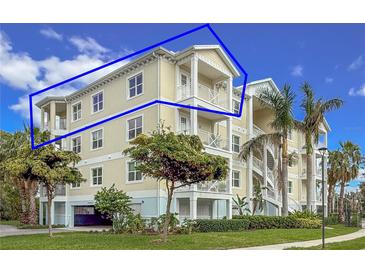 Two-story building exterior, featuring light-colored walls and balconies at 7610 34Th W Ave # 301, Bradenton, FL 34209